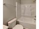 This bathroom features a white toilet and shower/tub with a silver shower head at 1236 Pinedale Nw Cir, Conyers, GA 30012