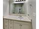 Bathroom featuring a large mirror, neutral countertops, and updated fixtures at 1236 Pinedale Nw Cir, Conyers, GA 30012