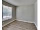 This bedroom features durable wood-look flooring and a bright window providing ample natural light at 1236 Pinedale Nw Cir, Conyers, GA 30012