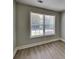 Comfortable bedroom featuring a bright window and modern flooring at 1236 Pinedale Nw Cir, Conyers, GA 30012