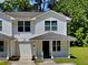 Charming two-story townhouse with a cozy front porch and well-maintained lawn at 1236 Pinedale Nw Cir, Conyers, GA 30012