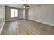Spacious living room with wood-look floors, neutral paint, and ample natural light at 1236 Pinedale Nw Cir, Conyers, GA 30012