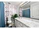 Bathroom with modern floral wallpaper, sink, mirror, and shower at 3149 Buford Ne Hwy # 2, Atlanta, GA 30329