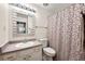 Functional bathroom with a patterned shower curtain and neutral wall color at 3149 Buford Ne Hwy # 2, Atlanta, GA 30329