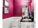 Charming powder room with magenta walls and decorative floral art at 3149 Buford Ne Hwy # 2, Atlanta, GA 30329