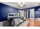 Comfortable bedroom featuring modern ceiling fan, closet and hardwood floors at 3149 Buford Ne Hwy # 2, Atlanta, GA 30329