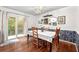 Charming dining room with wood floors, decorative wallpaper, and a sliding glass door at 3149 Buford Ne Hwy # 2, Atlanta, GA 30329
