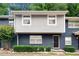 Inviting two-story townhome with a beautifully painted brick facade and lush landscaping at 3149 Buford Ne Hwy # 2, Atlanta, GA 30329