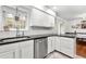 Bright kitchen features white cabinets, stainless steel appliances, and a sleek dark countertop at 3149 Buford Ne Hwy # 2, Atlanta, GA 30329