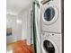 Bright laundry room with stacked washer and dryer at 3149 Buford Ne Hwy # 2, Atlanta, GA 30329