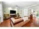 Bright living room with hardwood floors, cozy furniture, and natural light at 3149 Buford Ne Hwy # 2, Atlanta, GA 30329