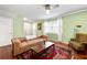 Cozy living room with hardwood floors, a comfortable leather sofa, and ample natural light at 3149 Buford Ne Hwy # 2, Atlanta, GA 30329