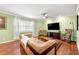 Inviting living room featuring hardwood floors, a comfortable couch, and a ceiling fan at 3149 Buford Ne Hwy # 2, Atlanta, GA 30329
