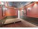 Basement home theater with a tiered platform, sconce lighting, and a projector for immersive entertainment at 4046 Water Hole Ct, Douglasville, GA 30135