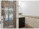 Bathroom with glass enclosed shower featuring designer tile, stylish vanity, and modern fixtures at 4046 Water Hole Ct, Douglasville, GA 30135