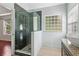 Modern bathroom featuring a glass-enclosed shower, granite countertop, and stylish fixtures at 4046 Water Hole Ct, Douglasville, GA 30135