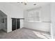 Bedroom featuring closet, neutral carpet and window with blinds offering ample natural light at 4046 Water Hole Ct, Douglasville, GA 30135