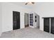 Bedroom featuring neutral carpet, closet, open doorway and black accent furniture at 4046 Water Hole Ct, Douglasville, GA 30135