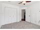 Cozy bedroom features a closet, trimwork, and plush carpeting at 4046 Water Hole Ct, Douglasville, GA 30135