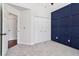 Bedroom featuring plush carpet, an accent wall, and double door closet at 4046 Water Hole Ct, Douglasville, GA 30135