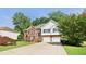 Charming two-story home with brick and siding exterior, plus a driveway and landscaped front yard at 4046 Water Hole Ct, Douglasville, GA 30135