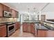 Kitchen featuring granite countertops, stainless steel appliances, and tile backsplash at 4046 Water Hole Ct, Douglasville, GA 30135