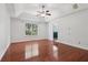 Spacious bedroom featuring a trey ceiling, wood floors, and a large window at 4046 Water Hole Ct, Douglasville, GA 30135