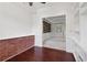 Home office featuring brick accent wall and built-in shelves at 4046 Water Hole Ct, Douglasville, GA 30135