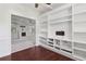 Office with hardwood floors, built-in shelving, and an open doorway view to the living room at 4046 Water Hole Ct, Douglasville, GA 30135