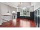 Sitting area with decorative wainscoting, a large window, and modern chandelier at 4046 Water Hole Ct, Douglasville, GA 30135