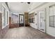 Inviting sunroom featuring brick accents, wood floors, and access to the backyard at 4046 Water Hole Ct, Douglasville, GA 30135