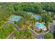 Aerial view of community amenities including tennis courts, pool, and clubhouse at 5007 Highland Oaks Se Ct, Smyrna, GA 30126