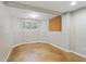 Unfinished basement with stained concrete floors, partial wall and window offering natural light at 5007 Highland Oaks Se Ct, Smyrna, GA 30126