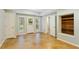 Basement with bright white trim, exterior door/windows, stained concrete flooring, and wood accent wall at 5007 Highland Oaks Se Ct, Smyrna, GA 30126