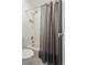 Traditional style bathroom featuring a shower with curtain and toilet at 5007 Highland Oaks Se Ct, Smyrna, GA 30126