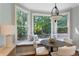 Cozy breakfast nook with a bay window overlooking a serene backyard at 5007 Highland Oaks Se Ct, Smyrna, GA 30126