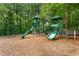 Community playground with slides, swings, and climbing structures for children at 5007 Highland Oaks Se Ct, Smyrna, GA 30126