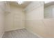 Empty walk-in closet featuring neutral carpet and adjustable shelving at 5007 Highland Oaks Se Ct, Smyrna, GA 30126
