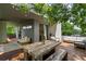 This multi-use balcony is perfect for outdoor entertaining or relaxing under the string lights at 670 Willoughby Ne Way, Atlanta, GA 30312