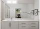 Modern bathroom featuring sleek cabinetry, a large mirror, and contemporary fixtures at 670 Willoughby Ne Way, Atlanta, GA 30312