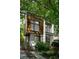 Modern home with unique architectural design, large windows, and lush greenery at 670 Willoughby Ne Way, Atlanta, GA 30312