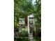 Modern two-story home featuring large windows and a beautifully landscaped yard at 670 Willoughby Ne Way, Atlanta, GA 30312