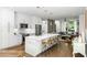 Modern kitchen with white cabinets, stainless steel appliances, a large island with bar seating, and an open floor plan at 670 Willoughby Ne Way, Atlanta, GA 30312