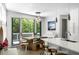 Eat-in kitchen features an island, stainless steel appliances, and sliding doors to a deck at 670 Willoughby Ne Way, Atlanta, GA 30312