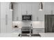 Modern kitchen featuring stainless steel appliances and subway tile backsplash at 670 Willoughby Ne Way, Atlanta, GA 30312