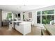 Open kitchen features a large island, stainless steel appliances, and hardwood floors throughout the main living area at 670 Willoughby Ne Way, Atlanta, GA 30312