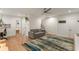 Spacious living room with hardwood floors, modern decor, and access to other areas at 670 Willoughby Ne Way, Atlanta, GA 30312