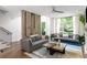 Spacious living room with modern decor, large windows, and hardwood floors at 670 Willoughby Ne Way, Atlanta, GA 30312