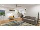 Inviting living room with a comfortable sofa, desk, and hardwood floors at 670 Willoughby Ne Way, Atlanta, GA 30312
