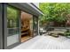 Outdoor deck with a dining table, seating area, and a view of the backyard at 670 Willoughby Ne Way, Atlanta, GA 30312
